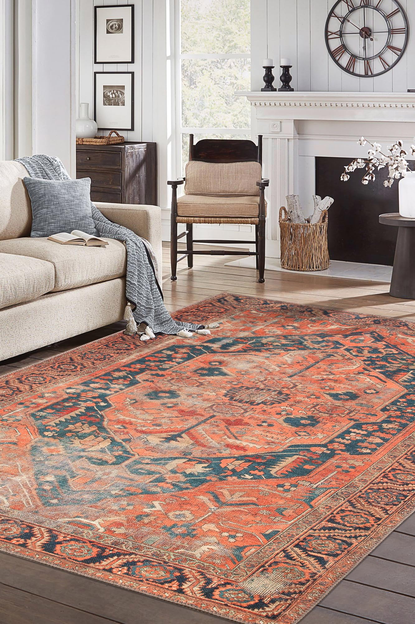 Top-down view of the rust orange and indigo antique Heriz Persian rug