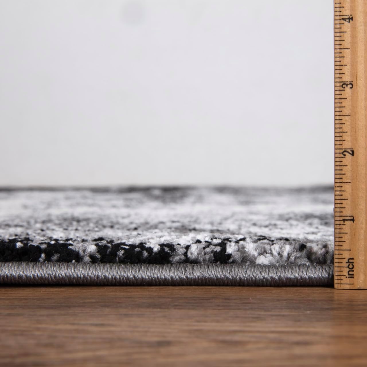 Detail of dark watercolor brushstrokes on the rug