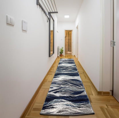 Skrik-design navy rug under a cream sofa with art on the walls