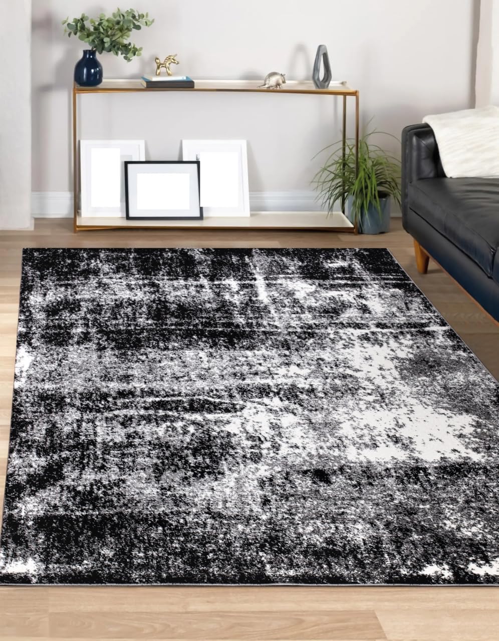 8x10 black abstract rug paired with a sectional sofa