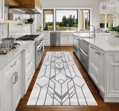 Top-down view of the Black and ivory Art Deco geometric outdoor rug
