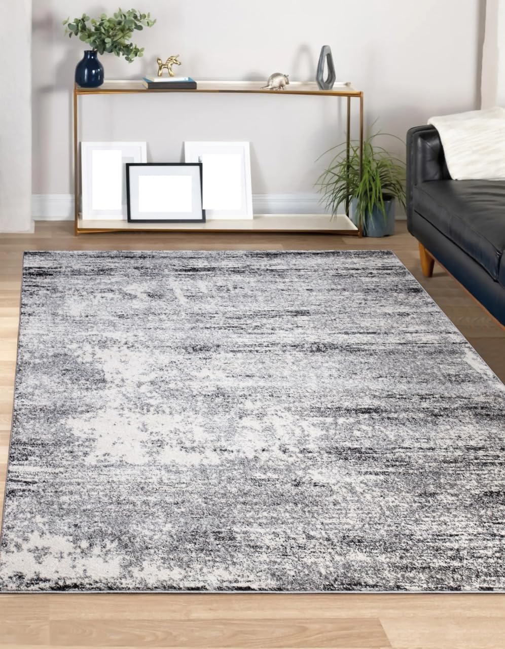 8x10 cream and gray abstract rug paired with a linen sectional