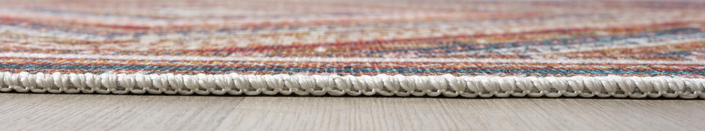 Detail of the geometric zigzag and star motifs on the cream rug
