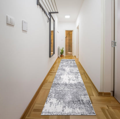 Cream and gray abstract rug in a transitional dining room