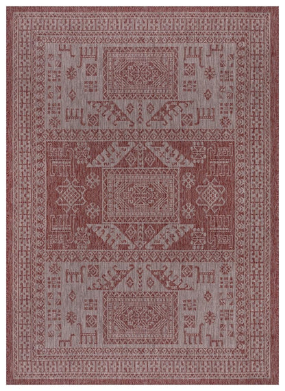 Terracotta and gray tribal heritage outdoor rug on covered teak patio
