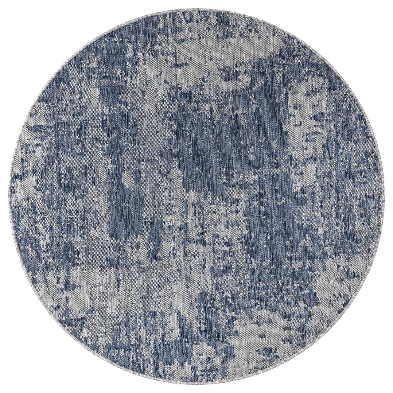 Navy and ivory abstract rug in screened porch setting