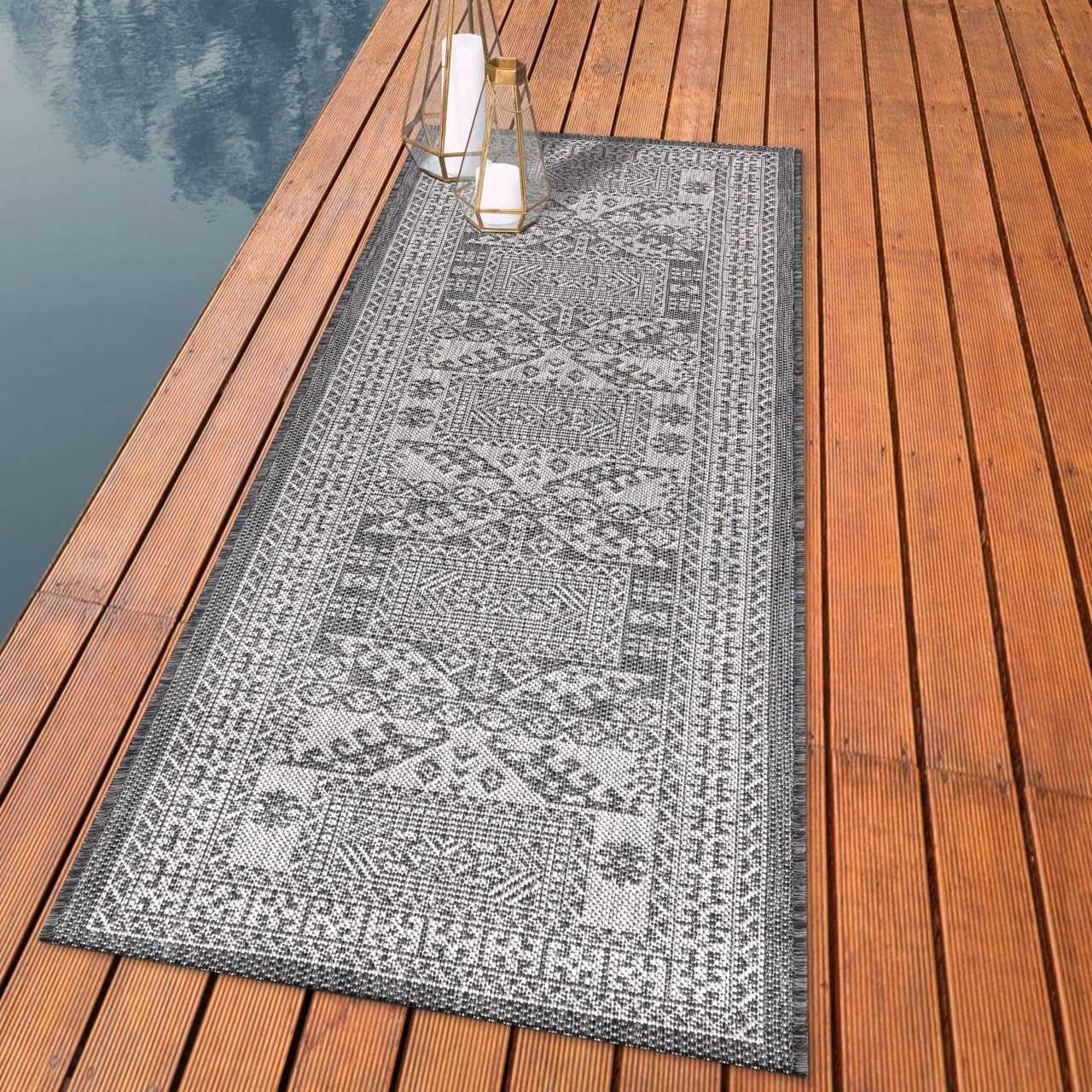 Tribal Caucasian outdoor rug styled with outdoor dining furniture