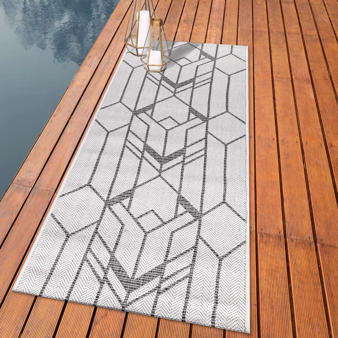 Art Deco chevron outdoor rug styled with modern dining furniture