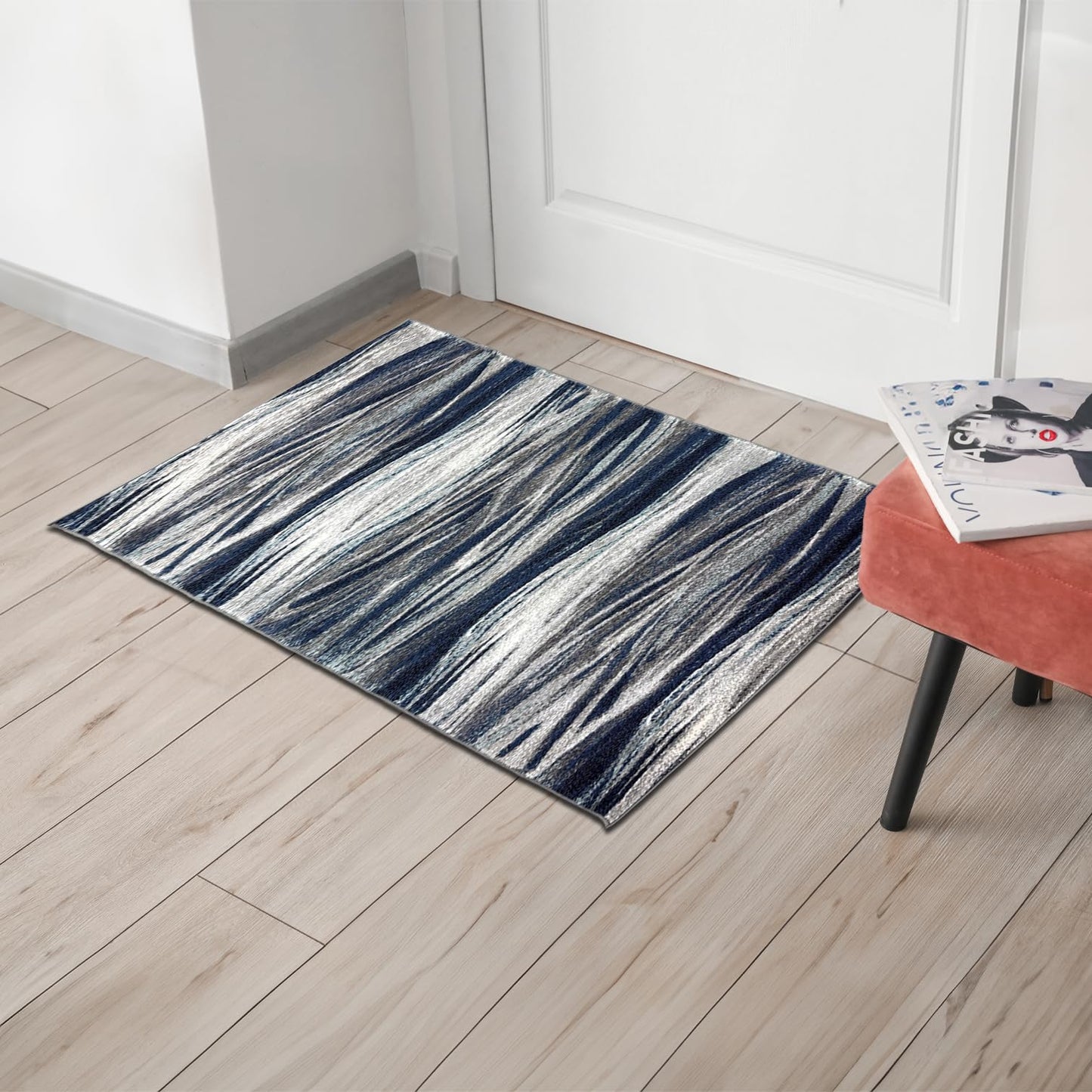 Navy Skrik rug under a coffee table with art books