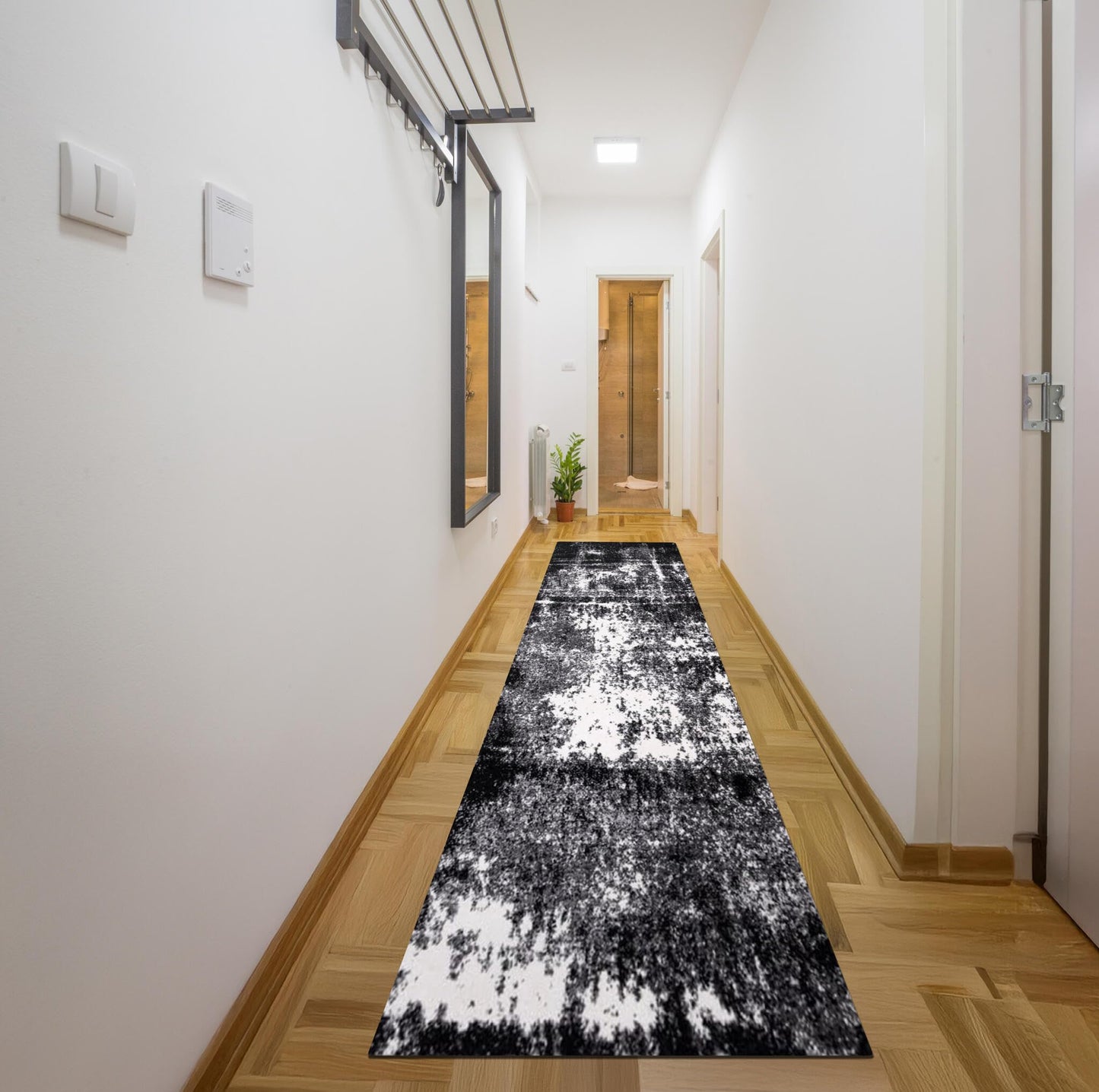 Industrial-style room with a black statement area rug