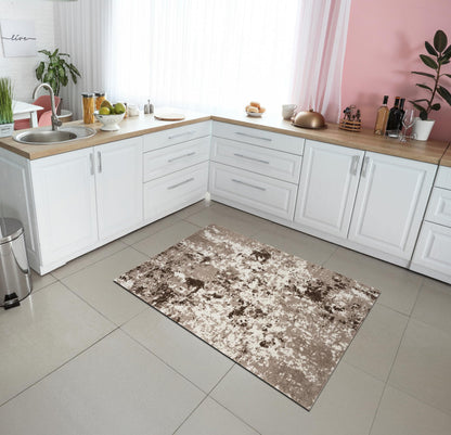 Full overhead view of the beige and tan abstract area rug
