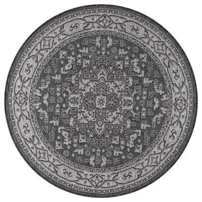 Black Heriz rug in formal courtyard screened porch setting