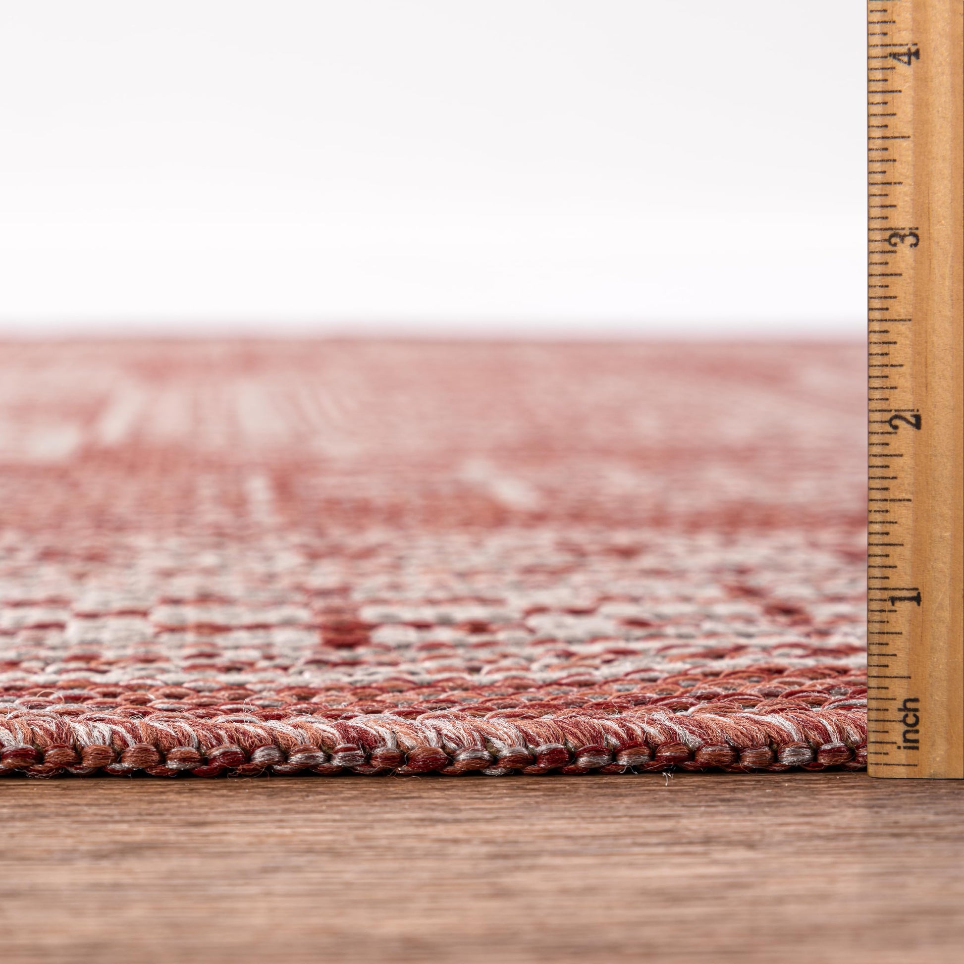 Bound edge detail of the Terracotta tribal heritage outdoor rug