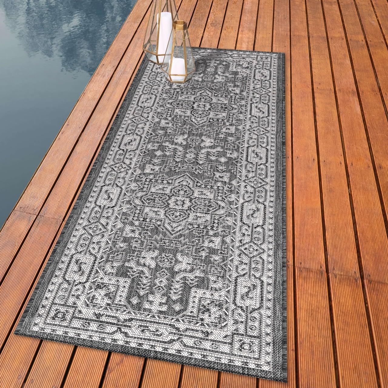 Persian Heriz medallion outdoor rug styled with formal dining furniture