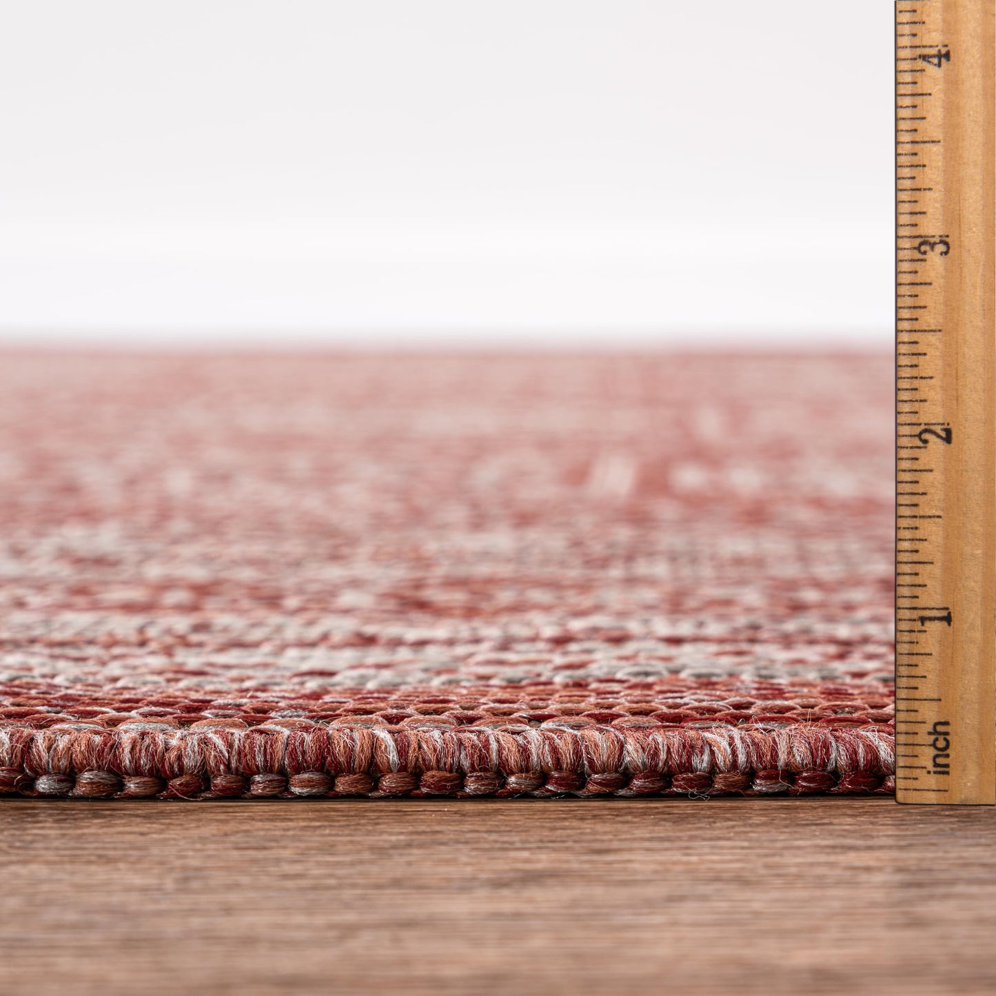 Terracotta Turkmen rug in mediterranean-style screened porch setting