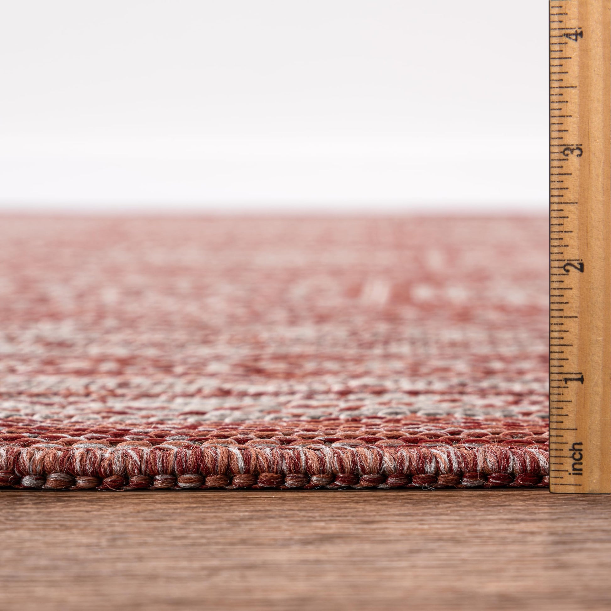 Terracotta Turkmen rug in mediterranean-style screened porch setting