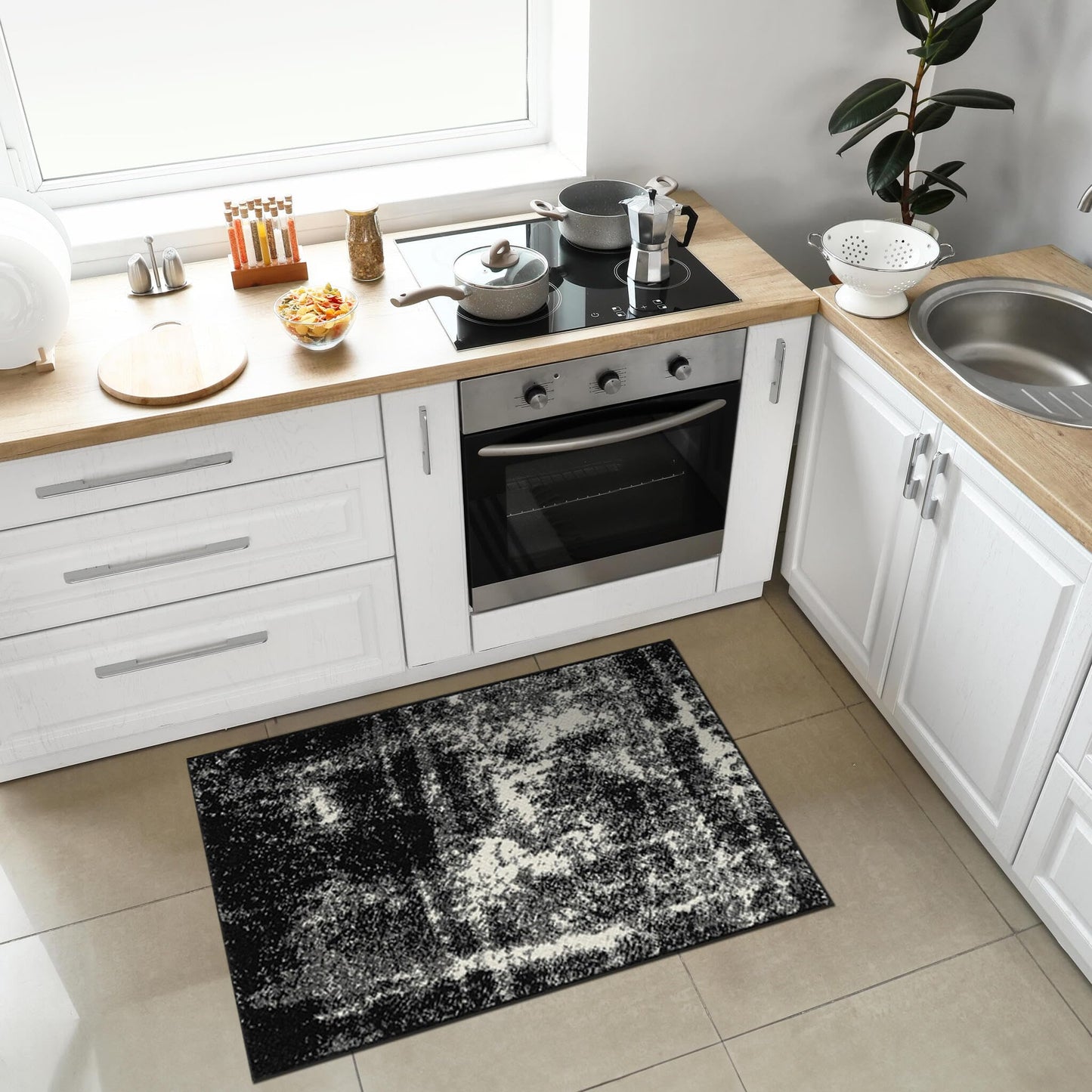 Low pile black abstract rug on light wood flooring
