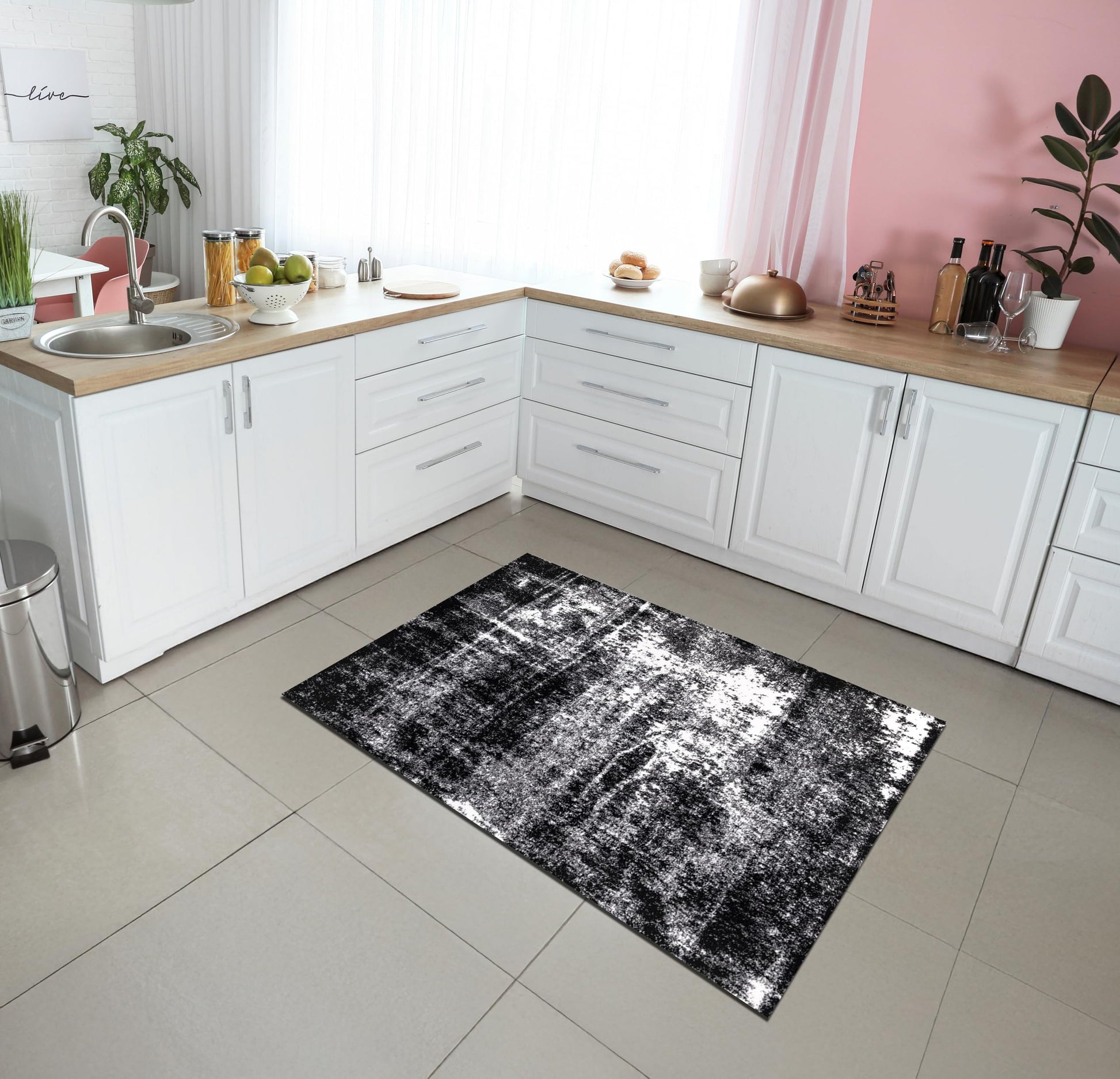 Open-plan living room with bold black abstract rug