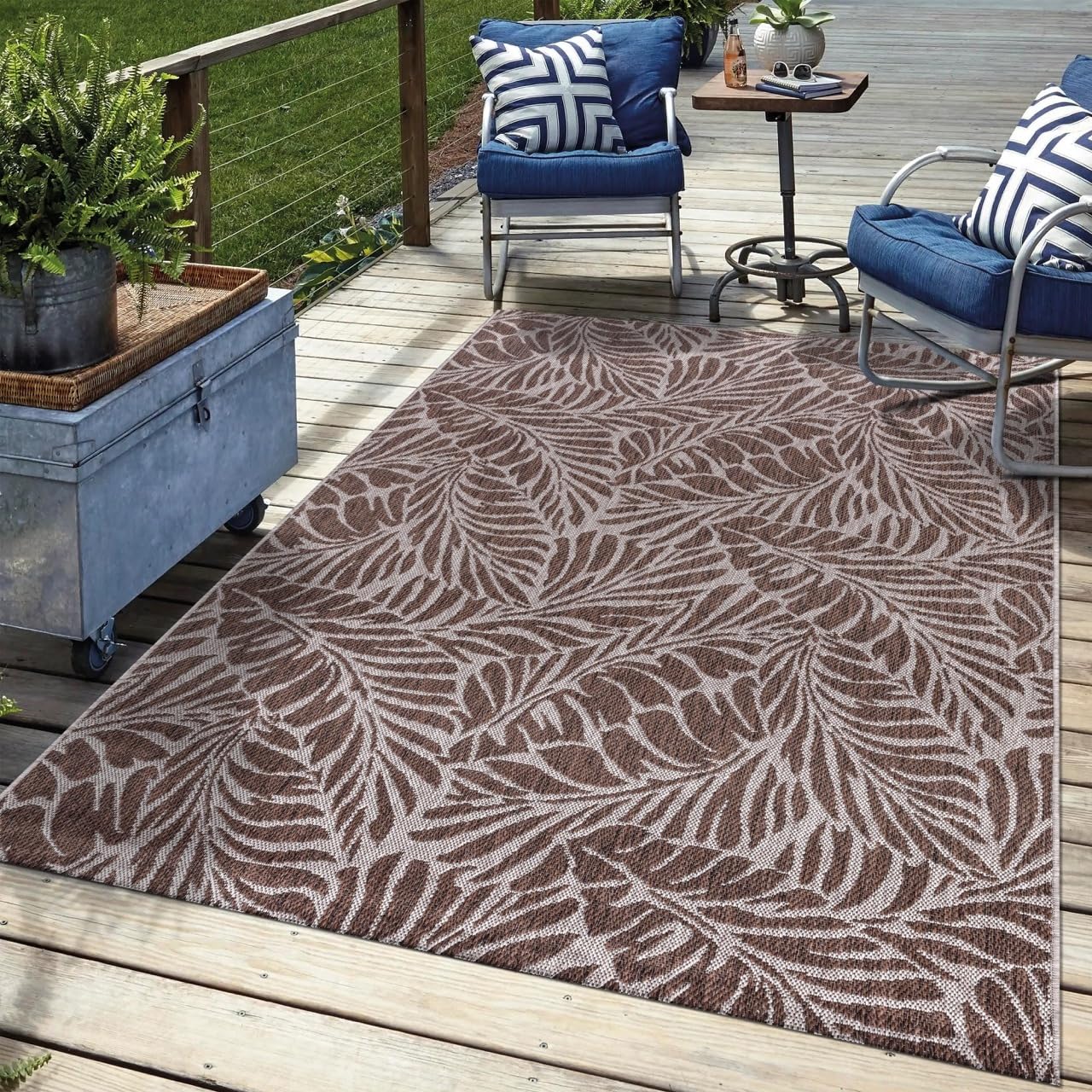 Brown tropical outdoor rug in garden seating area with greenery