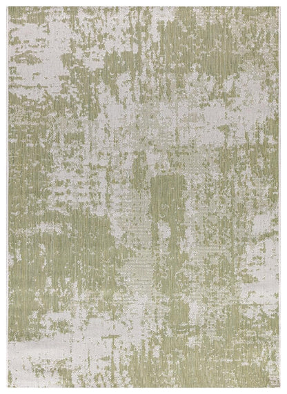 Green and ivory modern abstract outdoor rug on covered teak patio