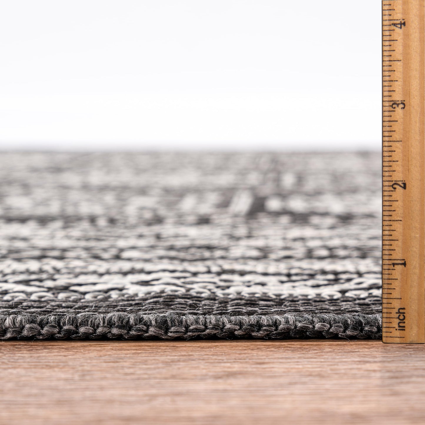 Bound edge detail of the Black Anatolian medallion outdoor rug