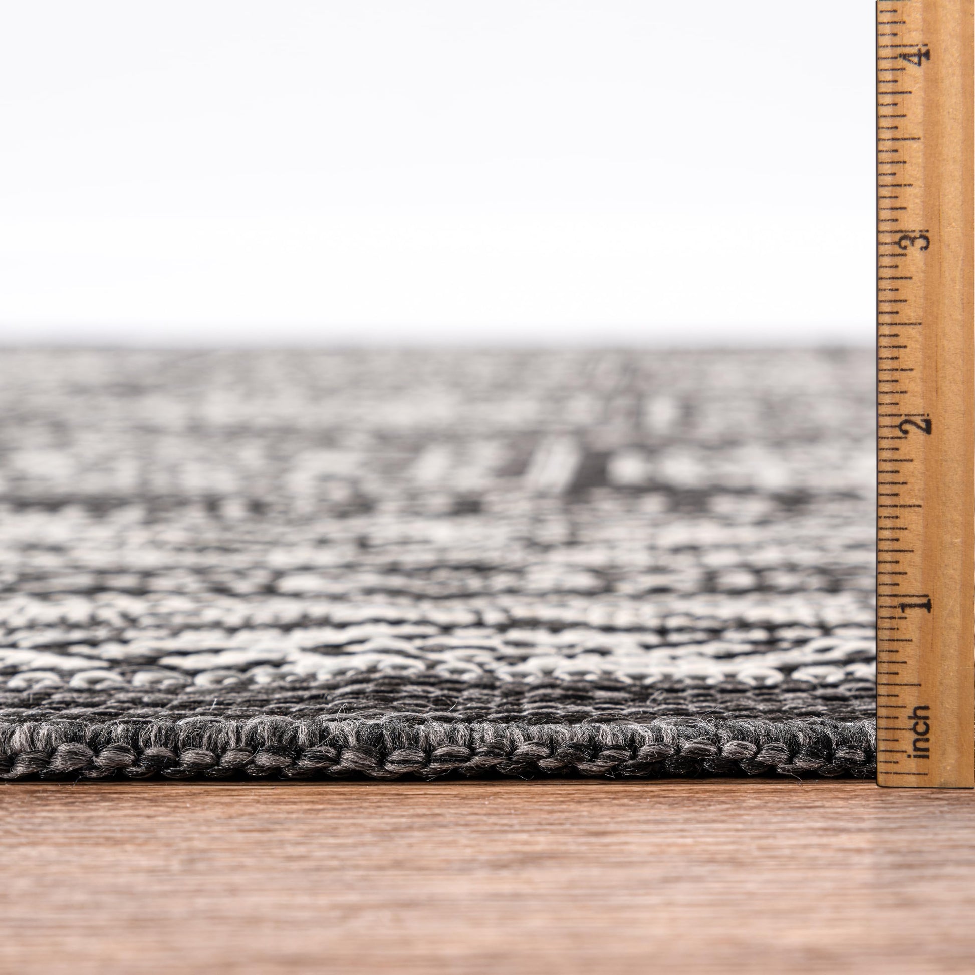 Bound edge detail of the Black Anatolian medallion outdoor rug