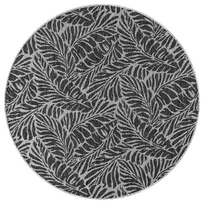 Black tropical rug in conservatory screened porch setting