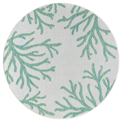 Green coral rug in beach house screened porch setting