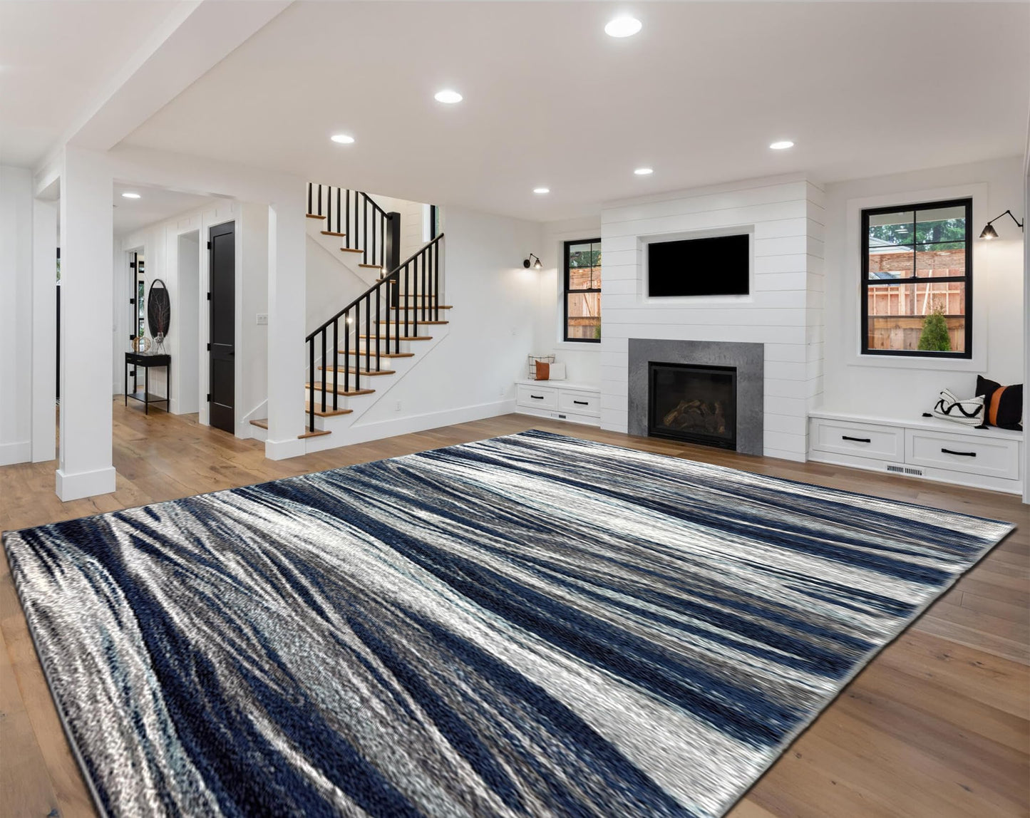 Navy abstract rug in a gallery-style living room