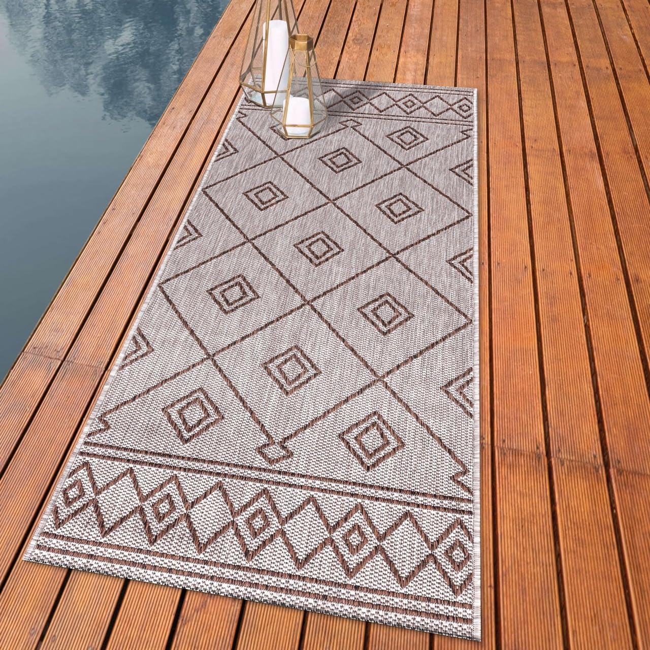 Beni Ourain diamond outdoor rug styled with rattan dining furniture