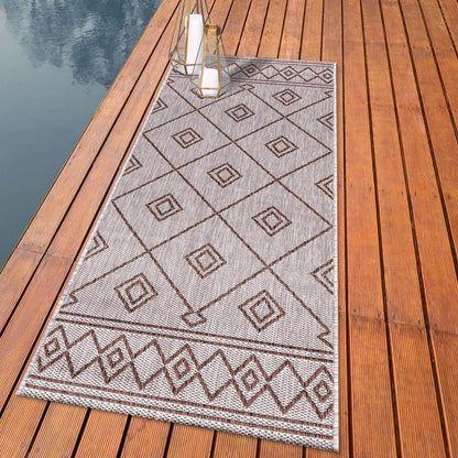 Beni Ourain diamond outdoor rug styled with rattan dining furniture