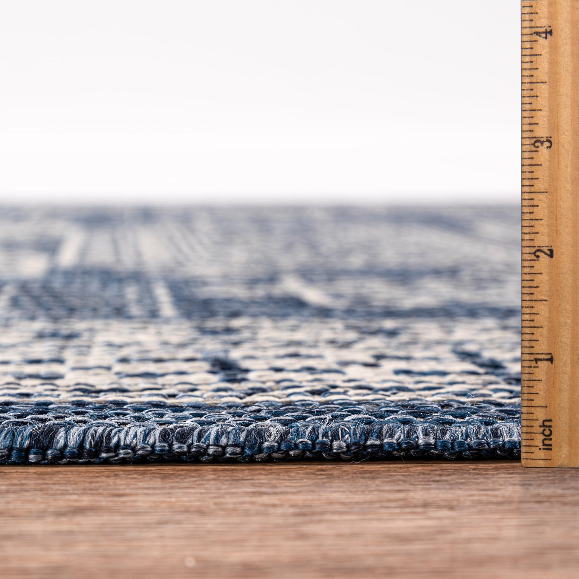 Bound edge detail of the Navy tribal heritage outdoor rug