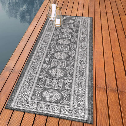 Anatolian heritage outdoor rug styled with mediterranean dining furniture