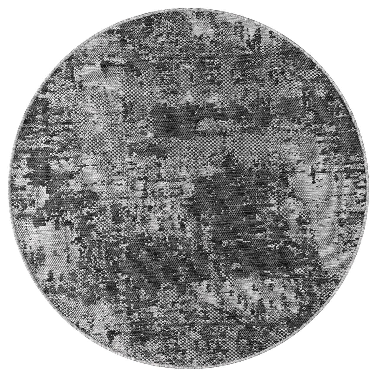 Black and ivory abstract rug in screened porch setting