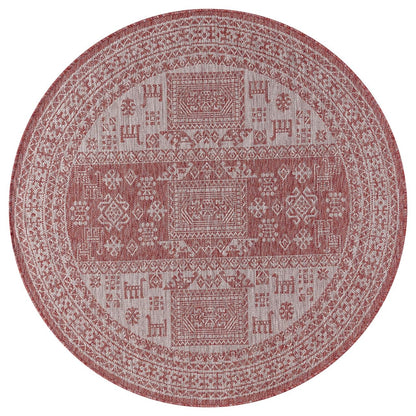 Terracotta tribal rug in southwestern-style screened porch setting