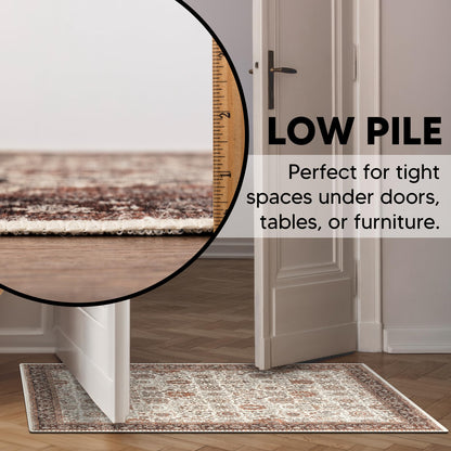 Detail of the chocolate brown border on the ivory Persian rug