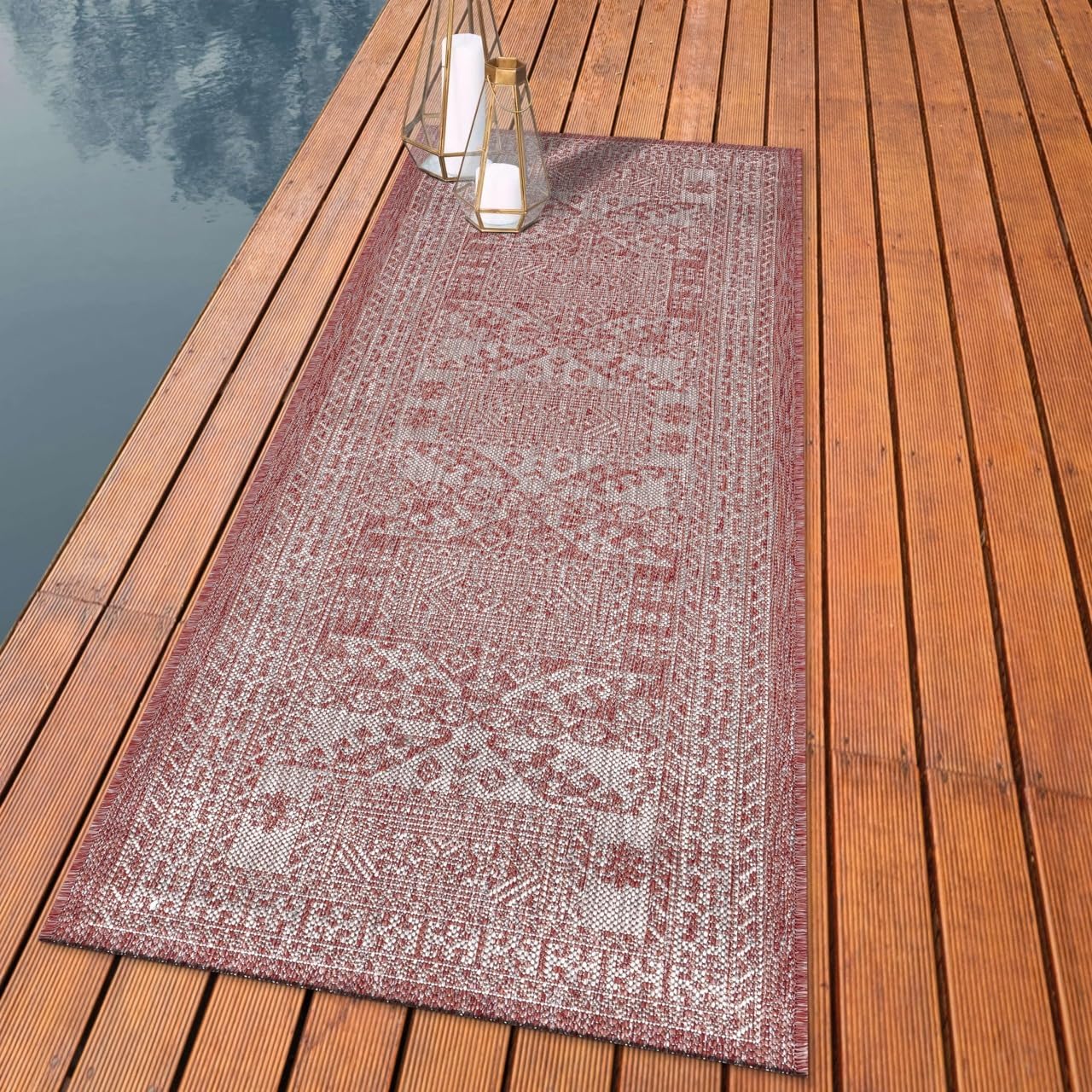Tribal Caucasian outdoor rug styled with outdoor dining furniture