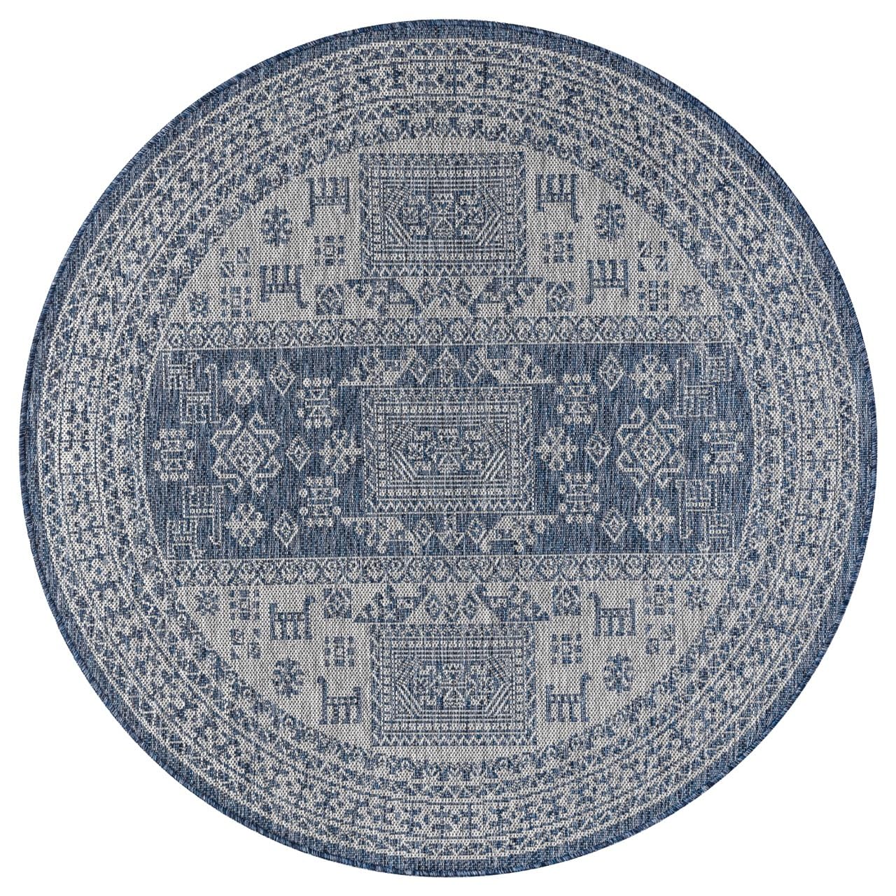 Navy tribal rug in southwestern-style screened porch setting