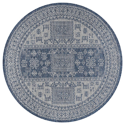 Navy tribal rug in southwestern-style screened porch setting
