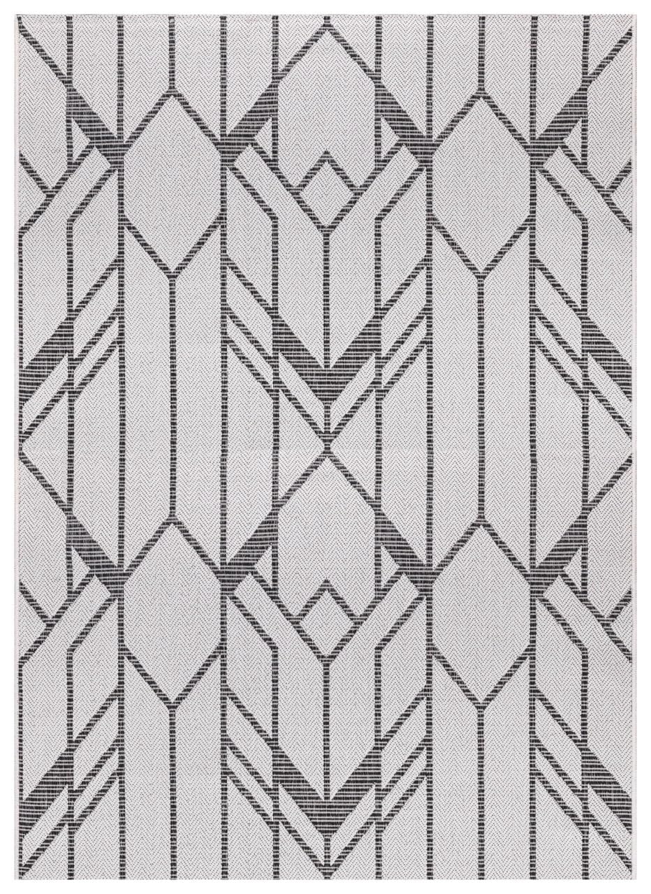 Black and ivory Art Deco geometric outdoor rug on covered urban patio