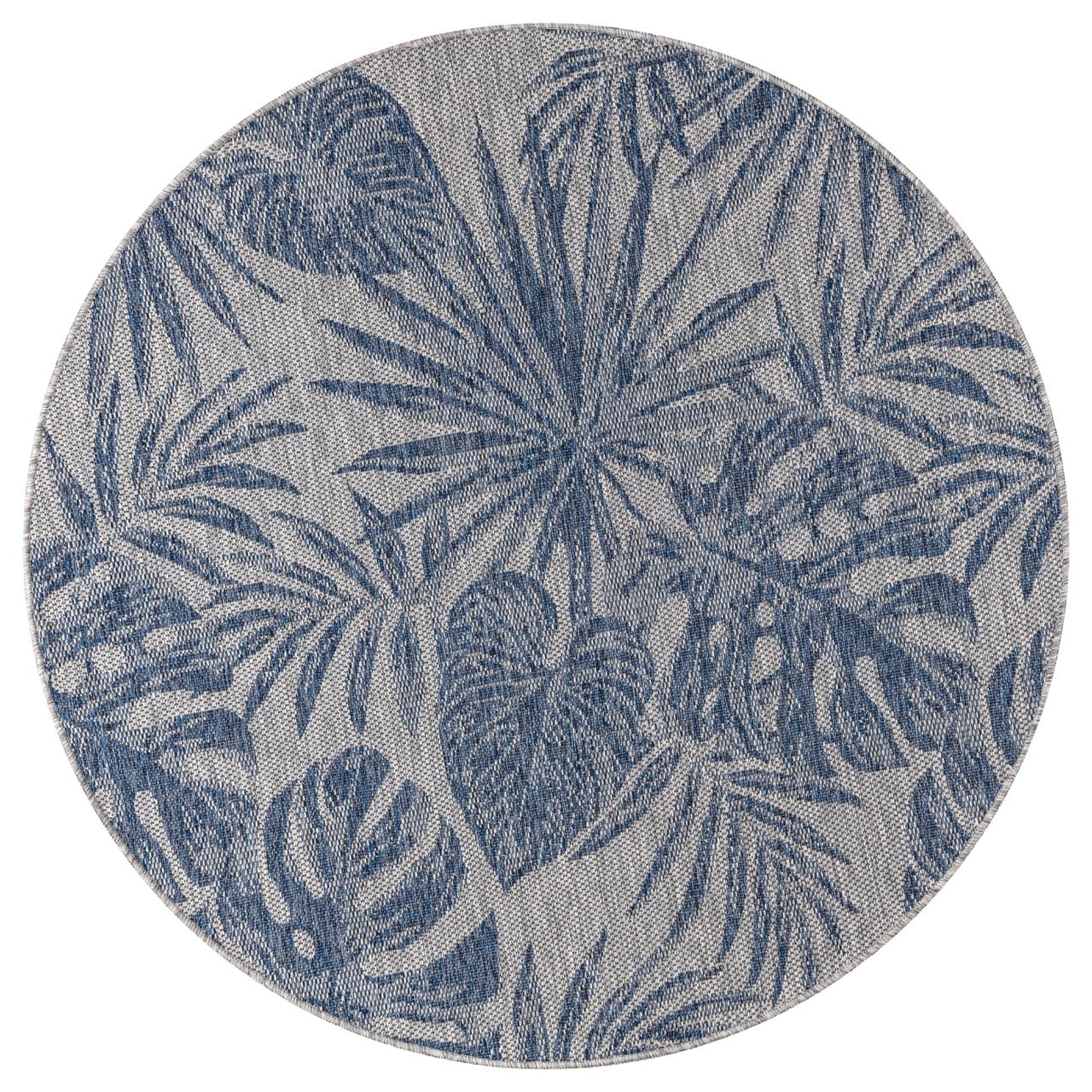 Navy tropical jungle rug in conservatory screened porch setting
