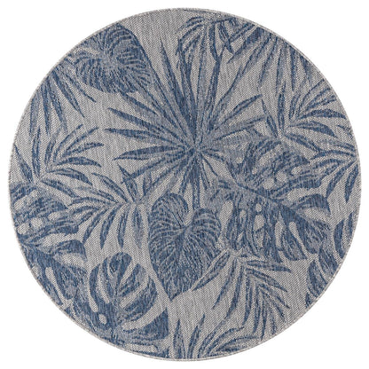 Navy tropical jungle rug in conservatory screened porch setting