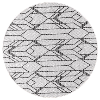 Black Art Deco rug in mid-century modern screened porch setting