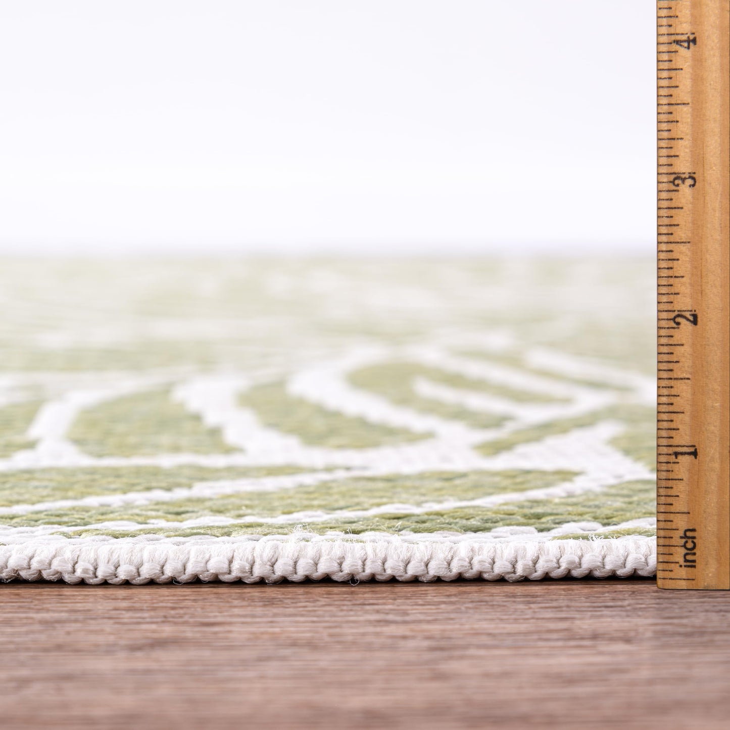 Bound edge detail of the Green tropical leaf outdoor rug