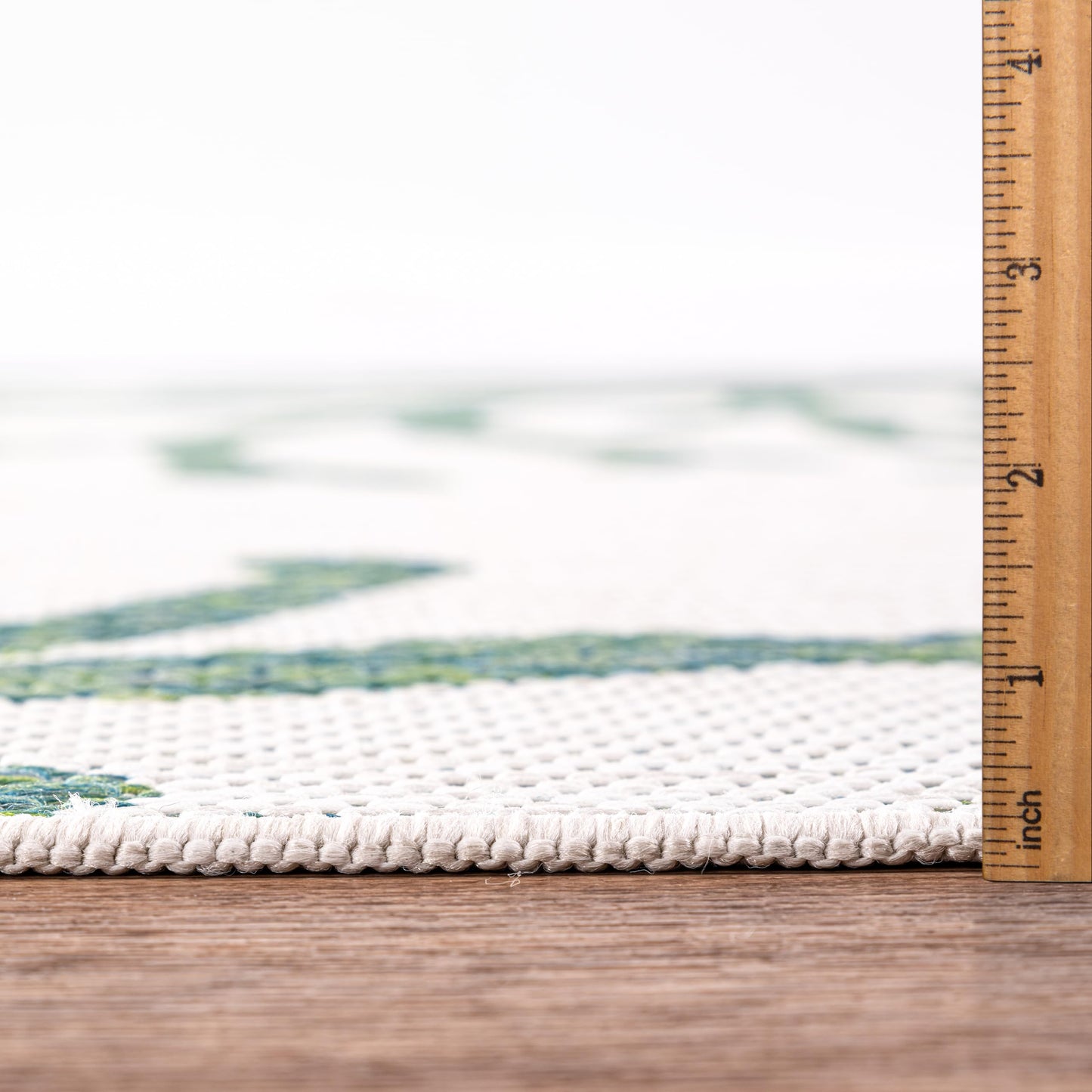 Bound edge detail of the Green coral pattern outdoor rug