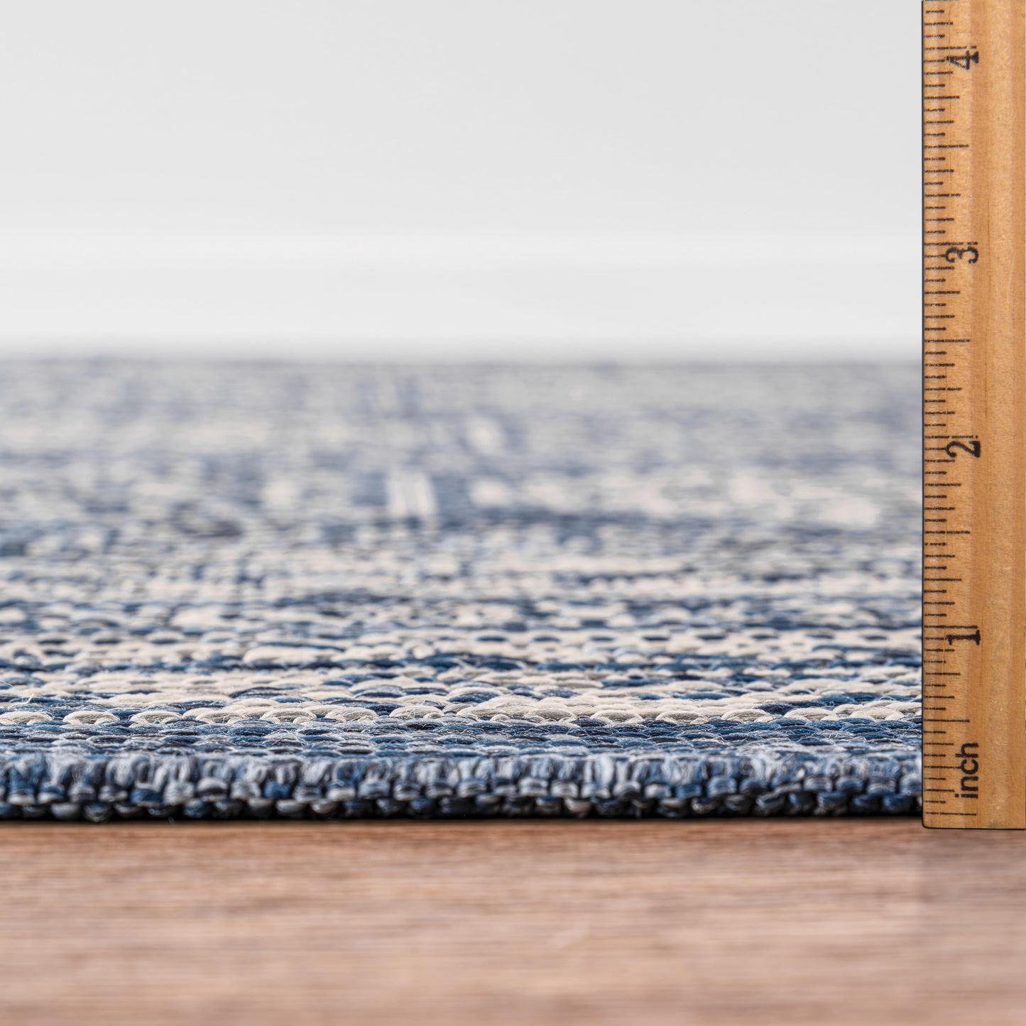 Bound edge detail of the Navy Anatolian medallion outdoor rug