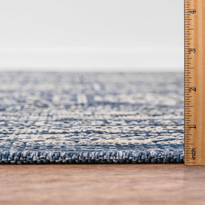 Bound edge detail of the Navy Anatolian medallion outdoor rug