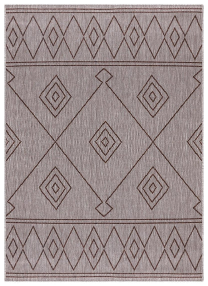 Brown and beige Berber Moroccan outdoor rug on covered teak patio