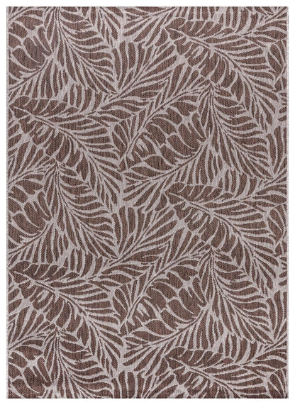 Brown and tan tropical leaf outdoor rug on covered teak patio