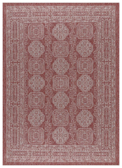 Terracotta and ivory Anatolian medallion outdoor rug on covered teak patio
